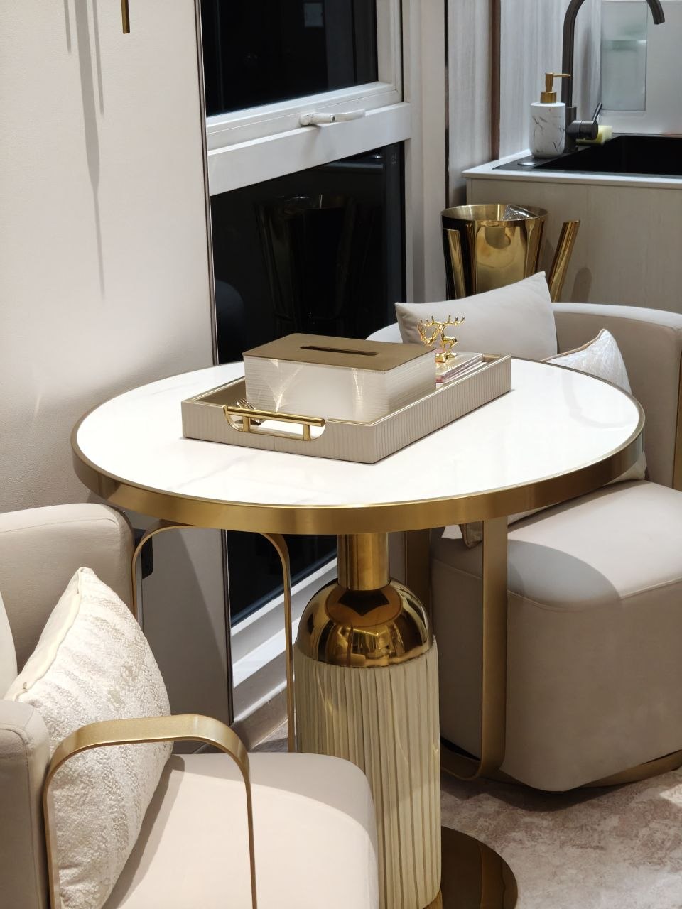 Off-white dining setting with gold and fluted details